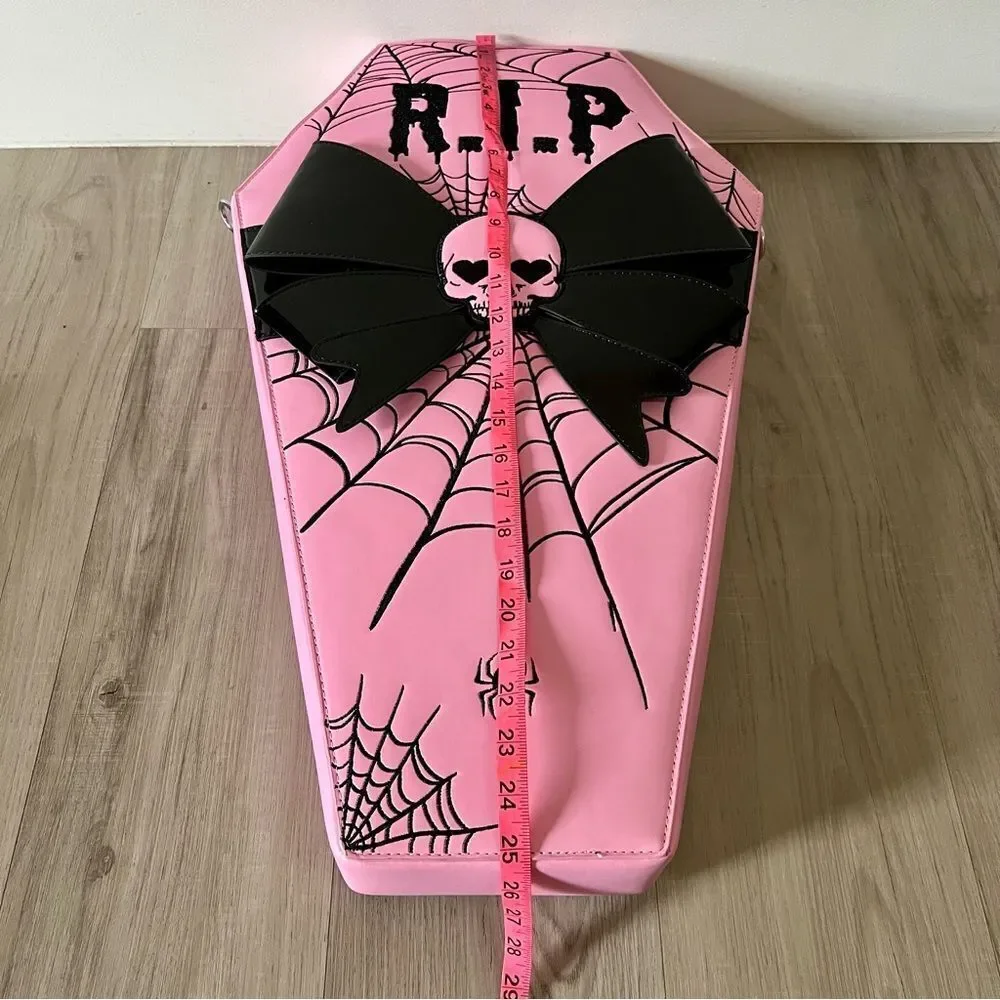 Dolls Kill oversize pink and black skull spiderweb coffin backpack. New in box